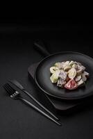 Delicious salad with boiled beef tongue, quail eggs, tomatoes and cucumber photo