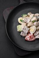 Delicious salad with boiled beef tongue, quail eggs, tomatoes and cucumber photo