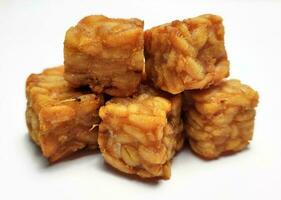 Fried tempeh, dice cutting, On White Background. photo
