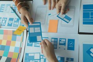 ux Graphic designer creative sketch planning application process development prototype wireframe for web mobile phone . User experience concept. photo