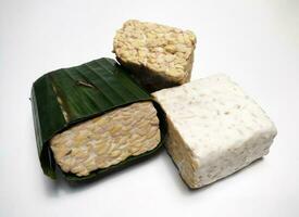 Raw Tempeh or Tempe, Indonesian traditional food, made from fermented soybeans, On White Background. photo