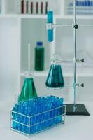 microscope with lab glassware, science laboratory research and development concept photo