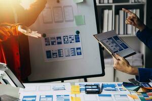 ux Graphic designer creative sketch planning application process development prototype wireframe for web mobile phone . User experience concept. photo
