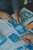 ux Graphic designer creative sketch planning application process development prototype wireframe for web mobile phone . User experience concept. photo