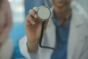 Male patient having consultation with doctor or psychiatrist who working on diagnostic examination on men's health disease or mental illness in medical clinic or hospital mental health service center photo