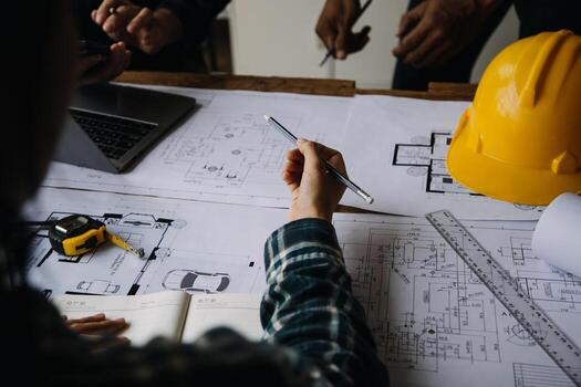 Construction and structure concept of Engineer or architect meeting for project working with partner and engineering tools on model building and blueprint in working site, contract for both companies. photo