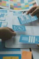 ux Graphic designer creative sketch planning application process development prototype wireframe for web mobile phone . User experience concept. photo