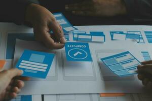 ux Graphic designer creative sketch planning application process development prototype wireframe for web mobile phone . User experience concept. photo