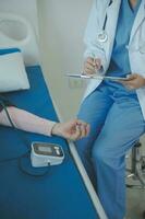 Male patient having consultation with doctor or psychiatrist who working on diagnostic examination on men's health disease or mental illness in medical clinic or hospital mental health service center photo