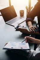 Financial Business team present. Business man hands hold documents with financial statistic stock photo, discussion, and analysis report data the charts and graphs. Finance Financial concept photo