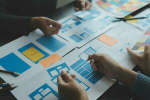 ux Graphic designer creative sketch planning application process development prototype wireframe for web mobile phone . User experience concept. photo