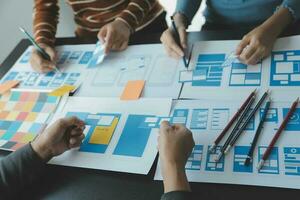 ux Graphic designer creative sketch planning application process development prototype wireframe for web mobile phone . User experience concept. photo