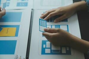 ux Graphic designer creative sketch planning application process development prototype wireframe for web mobile phone . User experience concept. photo