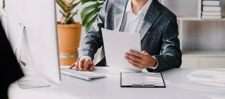 Document Businessman working modern computer Document Management System , Virtual online documentation database and process automation to efficiently manage files, photo