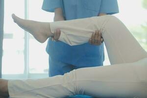 Patient doing some special exercises under supervision in a room photo