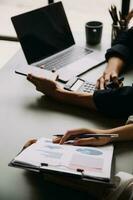 Financial Business team present. Business man hands hold documents with financial statistic stock photo, discussion, and analysis report data the charts and graphs. Finance Financial concept photo