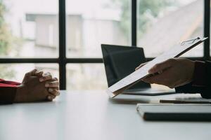 Close up view of job interview in office, focus on resume writing tips, employer reviewing good cv of prepared skilled applicant, recruiter considering application, hr manager making hiring decision photo