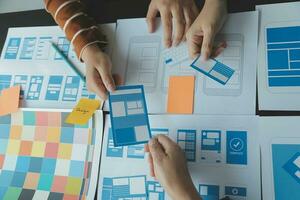 ux Graphic designer creative sketch planning application process development prototype wireframe for web mobile phone . User experience concept. photo