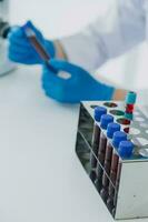 microscope with lab glassware, science laboratory research and development concept photo