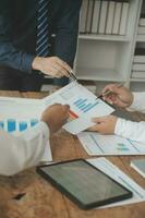 Team of business people working together in the meeting room office, teamwork background charts and graphs banner, double exposure successful teamwork,business planning concept. photo