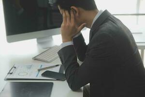 Group of confident business people point to graphs and charts to analyze market data, balance sheet, account, net profit to plan new sales strategies to increase production capacity. photo