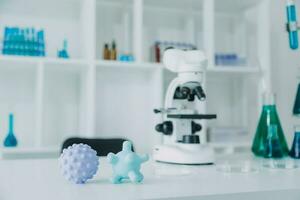 microscope with lab glassware, science laboratory research and development concept photo