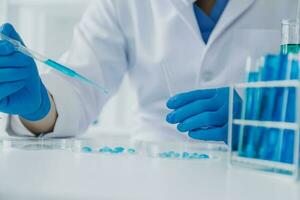 microscope with lab glassware, science laboratory research and development concept photo