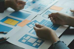 ux Graphic designer creative sketch planning application process development prototype wireframe for web mobile phone . User experience concept. photo