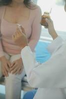 Male patient having consultation with doctor or psychiatrist who working on diagnostic examination on men's health disease or mental illness in medical clinic or hospital mental health service center photo