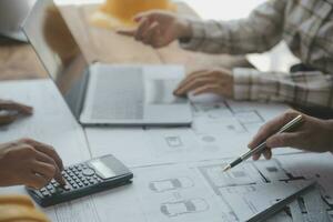 Two business man construction site engineer. Engineering objects on workplace with partners interacting on background photo