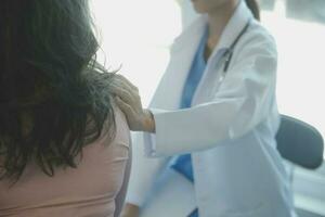 Male patient having consultation with doctor or psychiatrist who working on diagnostic examination on men's health disease or mental illness in medical clinic or hospital mental health service center photo