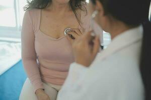 Male patient having consultation with doctor or psychiatrist who working on diagnostic examination on men's health disease or mental illness in medical clinic or hospital mental health service center photo