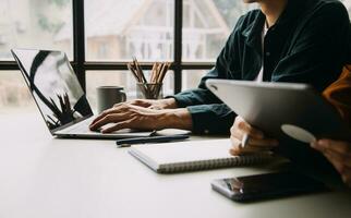 Financial Business team present. Business man hands hold documents with financial statistic stock photo, discussion, and analysis report data the charts and graphs. Finance Financial concept photo
