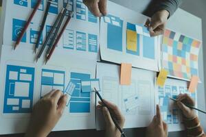 ux Graphic designer creative sketch planning application process development prototype wireframe for web mobile phone . User experience concept. photo