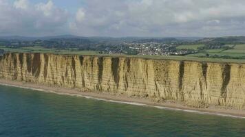 Tall Sandstone Cliffs of West Bay Along the Jurassic Coast of Southern England video