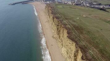 Tall Sandstone Cliffs of West Bay Along the Jurassic Coast of Southern England video