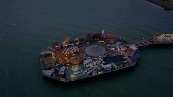 Brighton Seafront Pier Illuminated at Night Aerial View video