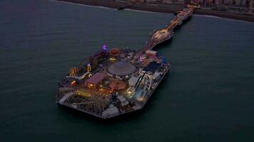 Brighton Seafront and Pier Illuminated at Night Aerial View video