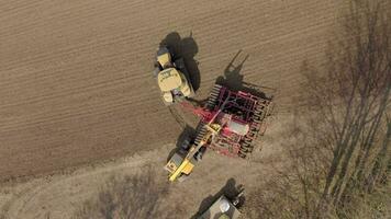 A Farmer Refilling a Seed Drill from a Bird's Eye View video