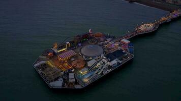 Brighton Seafront Pier Illuminated at Night Aerial View video