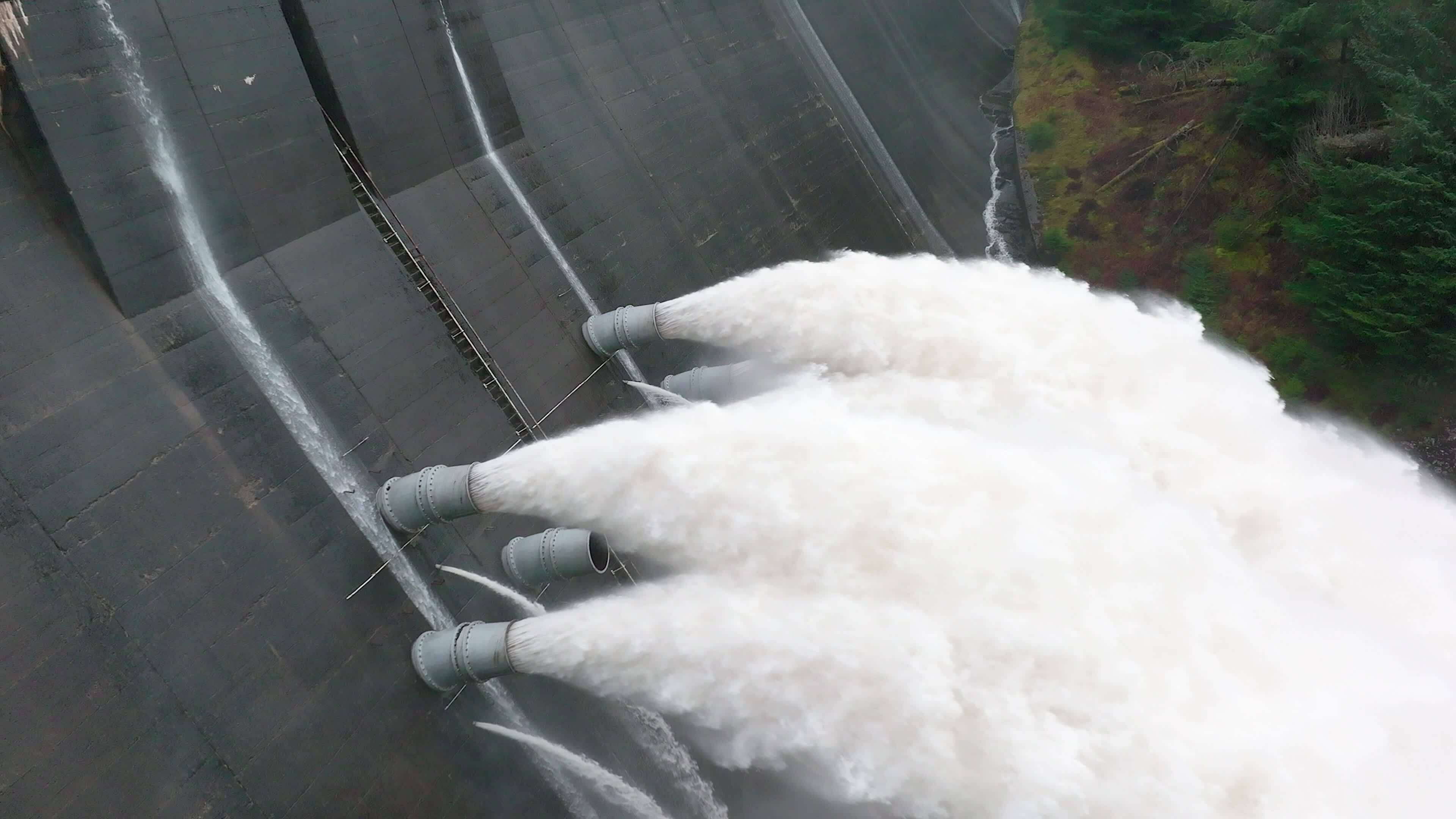 Water Pumped Through a Gravity Fed Hydroelectric Power Station Dam Slow