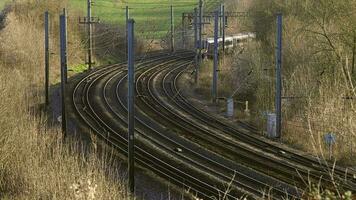 UK Commuter Train Travelling along the Railway Infrastructure video