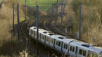 UK Commuter Train Travelling along the Railway Infrastructure video