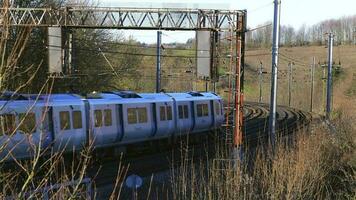 UK Commuter Train Travelling along the Railway Infrastructure video
