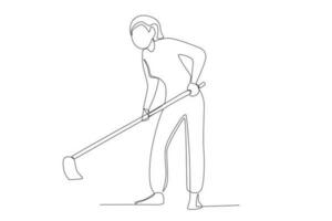 A woman hoeing in the garden vector