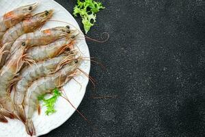 shrimps raw seafood prawn healthy meal food snack on the table copy space food background rustic top view photo