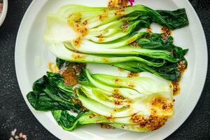 Bok choy or pak choy, Chinese stalked cabbage vegetable dish healthy meal food snack on the table copy space food background rustic top view keto or paleo diet veggie vegan or vegetarian food photo