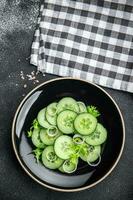 cucumber salad fresh vegetable healthy meal food snack on the table copy space food background rustic top view keto or paleo diet veggie vegan or vegetarian food photo