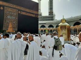 Mecca, Saudi Arabia, April 2023 - Pilgrims from all over the world are present in the courtyard of Masjid al-Haram for Tawaf. photo