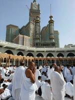 Mecca, Saudi Arabia, April 2023 - Pilgrims from all over the world are present in the courtyard of Masjid al-Haram for Tawaf. photo
